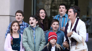 Odalis Sharp and several of her children sing outside the federal courthouse Wednesday, Feb. 24, 2016. The Sharps were there to support Ammon Bundy and other defendants who have pleaded not guilty to a federal conspiracy charge related to the armed takeover of an Oregon wildlife refuge. (Beth Nakamura/The Oregonian via AP) MAGS OUT; TV OUT; NO LOCAL INTERNET; THE MERCURY OUT; WILLAMETTE WEEK OUT; PAMPLIN MEDIA GROUP OUT; MANDATORY CREDIT